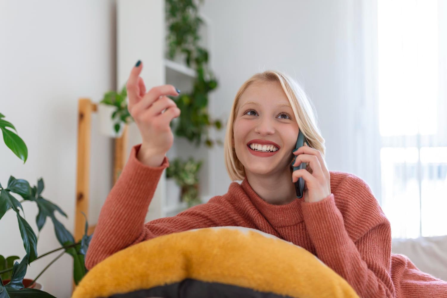 Woman video-calling and smiling while using a long-distance relationship app